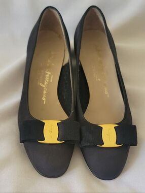 Salvatore Ferragamo Black Flats with Gold Plaque and Grosgrain Bow
